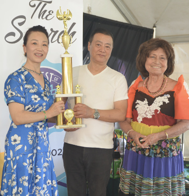 "The Search" 2025 Winners  Xuemei Liu and Jian Meng Wang with Dr. Nini.